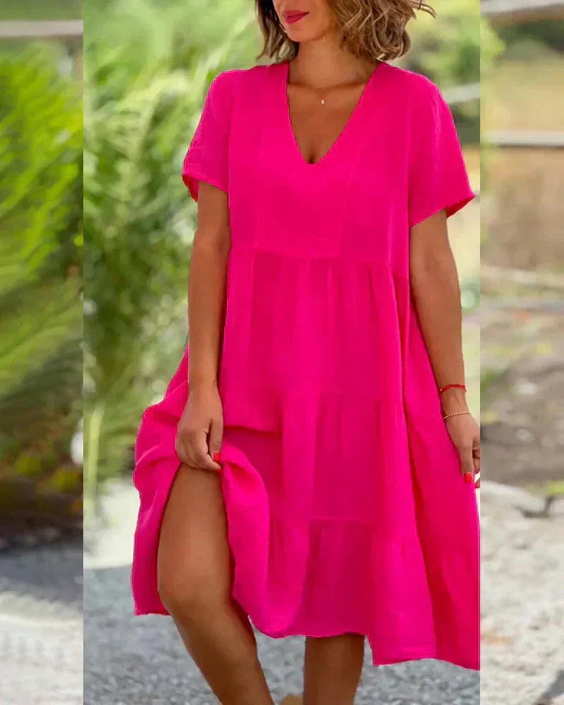 Różowa sukienka midi damska | dekolt w serek, krótki rękaw, krój A