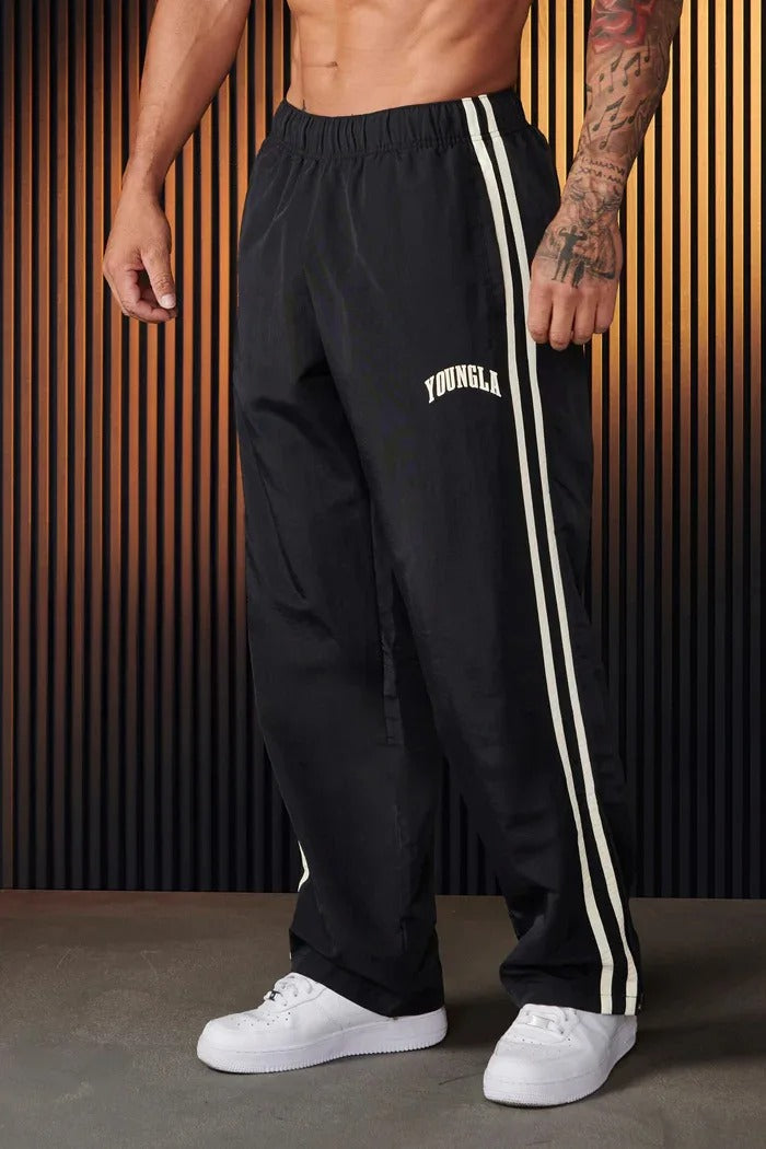 Pantalon de survêtement ample à bandes latérales pour homme