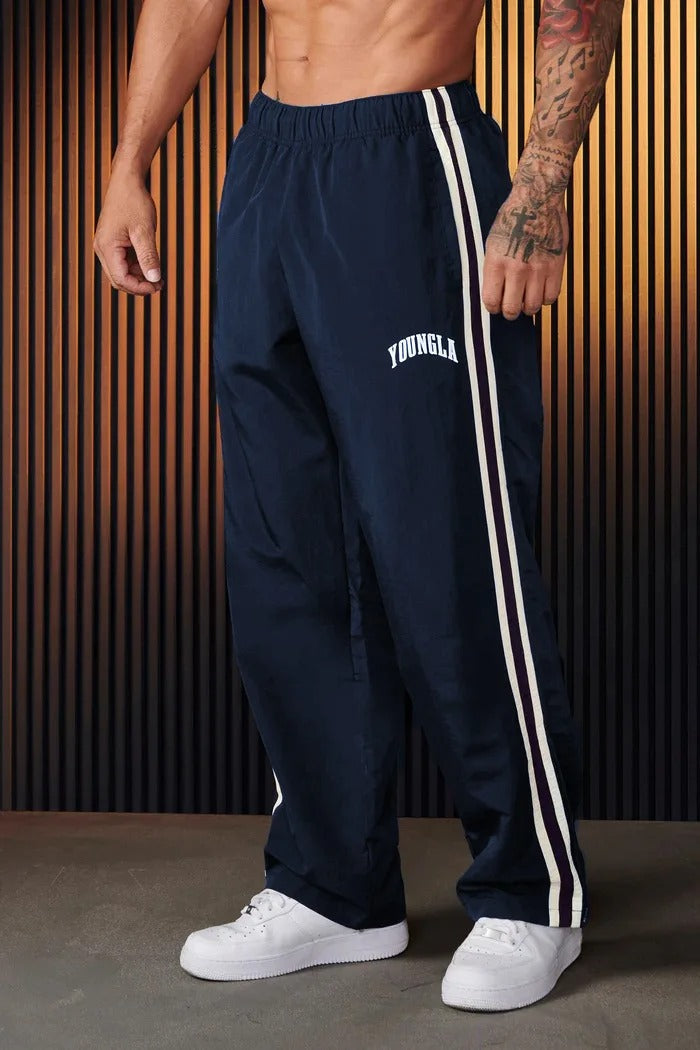 Pantalon de survêtement ample à bandes latérales pour homme